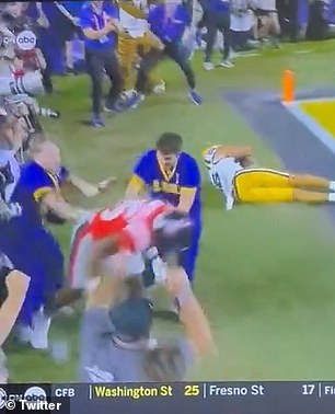 Television cameras captured the strange moment when an LSU male cheerleader shot the Ole Miss player