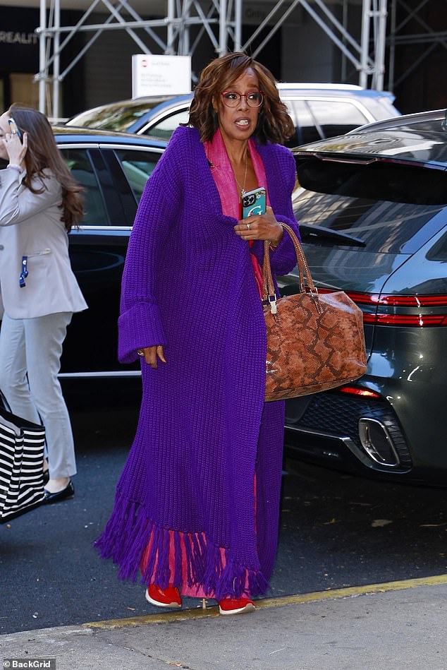 King, 69, wore a colorful ensemble that included a purple knit cardigan, pink wide-leg pants and red sneakers.