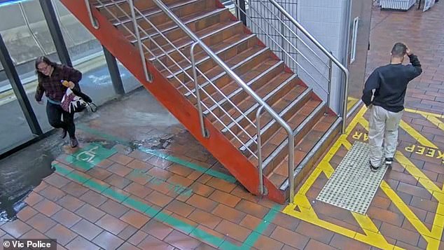 The pair are seen fleeing down the stairs after the station began flooding.