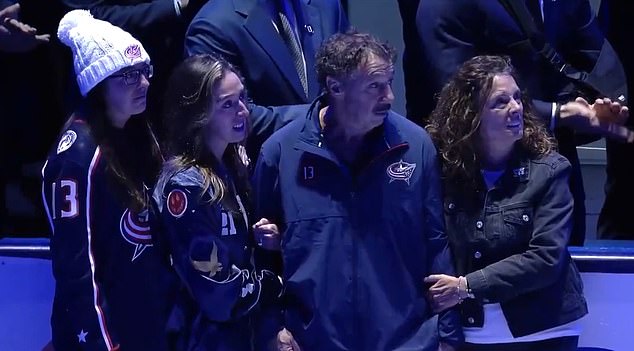 Johnny and Matthew's parents and sister watched the tributes from the sidelines.