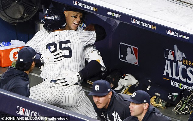 Judge and Gleyber Torres celebrate in the Yankees dugout after their home run in the seventh inning