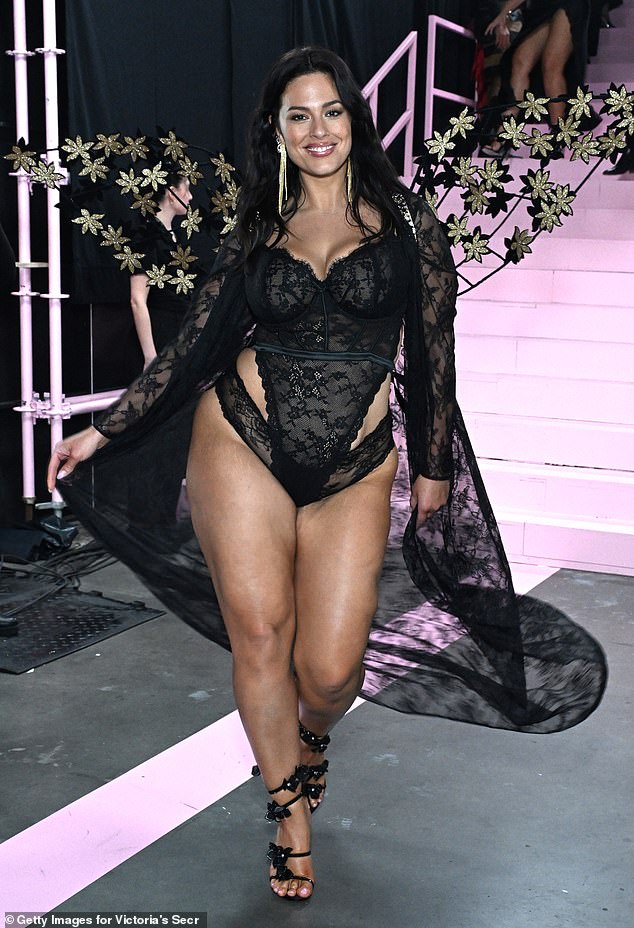 Graham appeared on the runway in a skin-tight black lace bodysuit over a matching thick-banded thong.