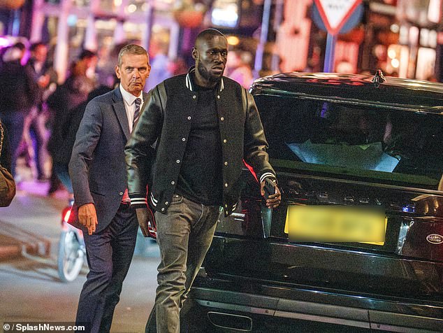 Stormzy, whose real name is Michael Owuo Jr., was photographed hugging and kissing American singer Victoria at London's Heathrow airport on Thursday night, seemingly confirming their blossoming relationship.