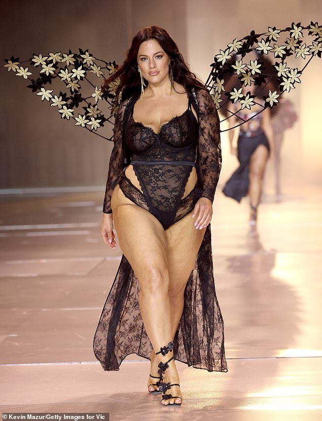 Ashley appeared on the runway in a skintight black lace bodysuit over a matching thick banded thong.