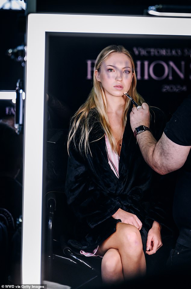 Lila was photographed getting ready backstage in Brooklyn for the Victoria's Secret Fashion Show on Tuesday while surrounded by makeup artists.