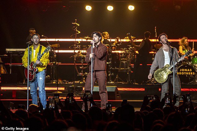 According to Joe, the brothers' musical careers were inevitable as they grew up with musically talented parents (pictured in Milan last month).