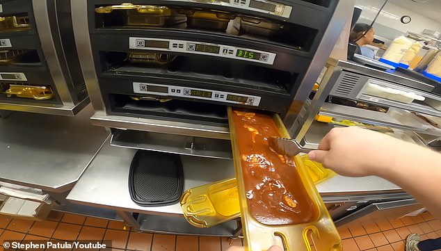 A video from 2022 shows a McDonald's employee in the United States dipping burgers in a thick brown barbecue sauce.