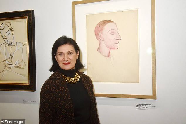 Paloma Picasso photographed next to her father's work in 2023