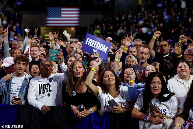 Supporters react during a campaign rally for Democratic presidential candidate and US Vice President Kamala Harris, in Erie, Pennsylvania.