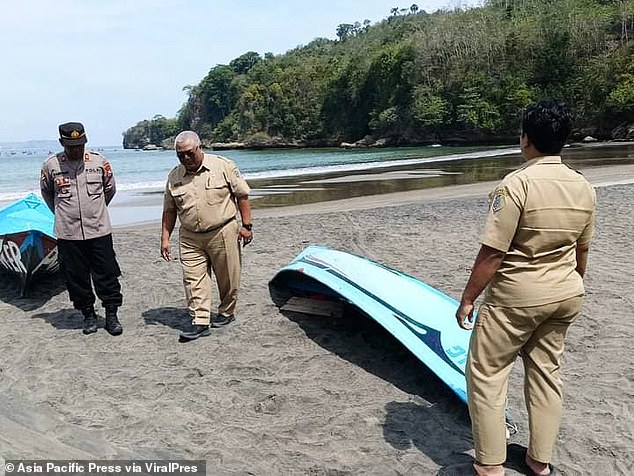 A rescue team scoured the sea in inflatable boats in search of Simanjuntak