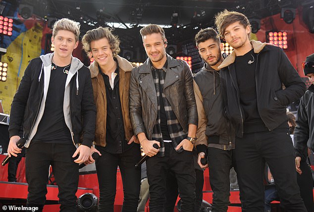 After X Factor, One Direction signed with Simon Cowell's Syco Entertainment; the group seen in 2013