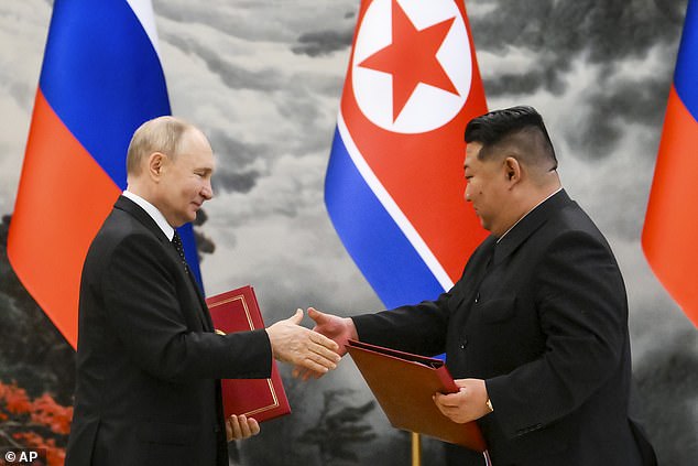 The troops were promised to Vladimir Putin by the country's president, Kim Jong-un, during a state visit to Pyongyang. Pictured: Russian President Vladimir Putin, left, and North Korean leader Kim Jong Un during a signing ceremony for the new partnership in Pyongyang, North Korea, June 19, 2024.