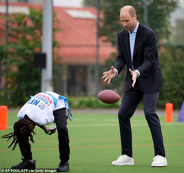 The Prince of Wales also showed off his quick reflexes by catching the ball during yesterday's match.