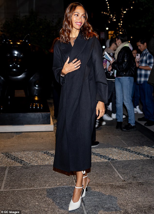 Zoe also put on a fashion show as she donned a black and white dress with sheer fabric on top.