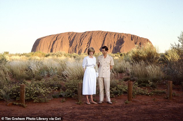 Diana and Charles pose for photographs at Ayers Rock (now known as Uluru) in the Northern Territory.