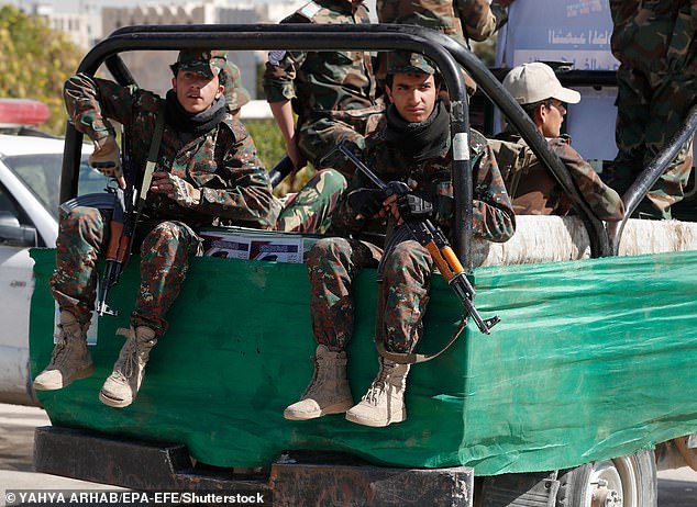 In addition to direct attacks on ships in the Red Sea, the Houthis have fired several missiles and drones directly at Israel. Pictured: Houthi fighters riding a truck patrol during a mass funeral for 29 Houthi fighters killed in recent fighting against Saudi-backed government forces, in Sana'a, Yemen, January 10, 2022.