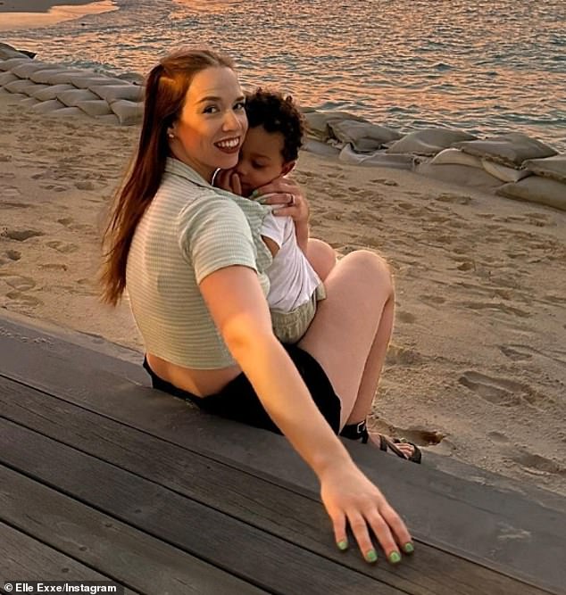 Linda is seen with her son on a trip to the Maldives earlier this year.