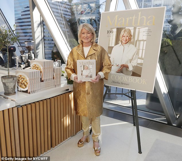 The housework expert looked very glamorous in her all-gold outfit as she celebrated her 100th book.