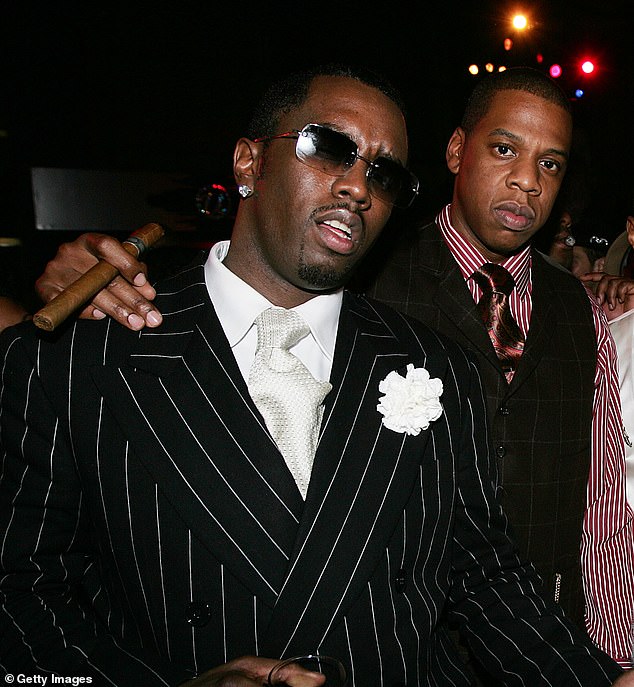 Payne also recalled being shoved by one of Jay-Z's bodyguards after he leaned over to talk to him. Jay-Z and Diddy appear in the photo in 2004.