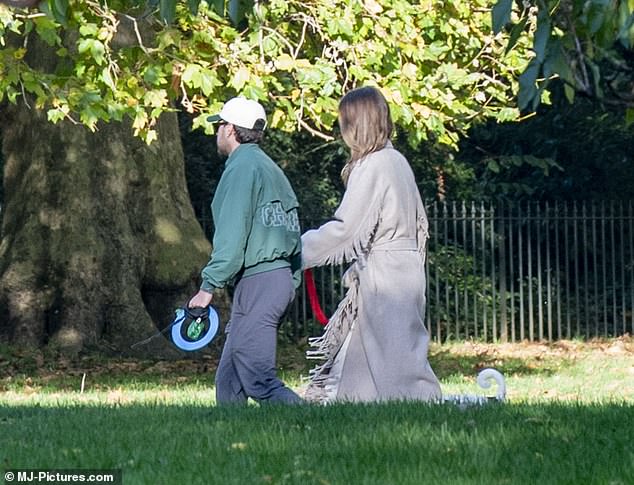 Horan looked somber as he and Amelia took their dog for a walk in the park.