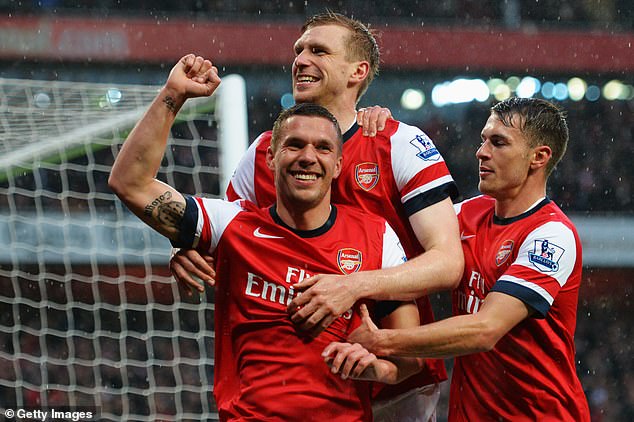 After spells at Cologne and Bayern Munich, Podolski (pictured center) joined Arsenal in 2012.