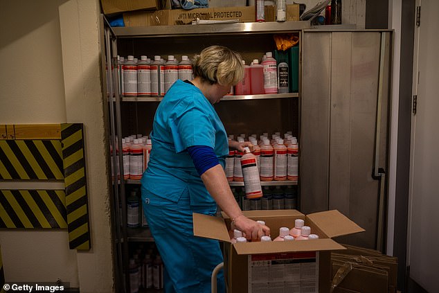 Embalming fluid is composed of chemicals that preserve and slow decay, including formaldehyde and methanol, as seen above in a funeral home.