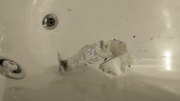 A burnt candle and more aluminum foil were found in a bathtub in the suite.