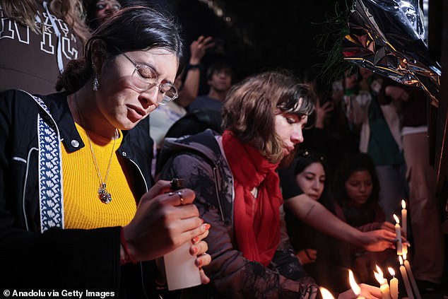 Some were photographed lighting candles and praying for the singer.