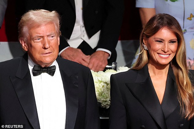 Donald and Melania sat together at dinner, both wearing similar tuxedo jackets.