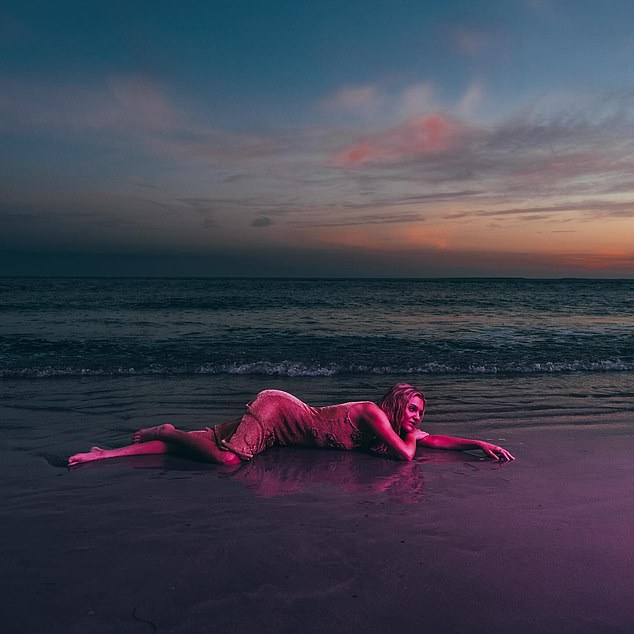 She also shared a picturesque image of herself lying on the beach.