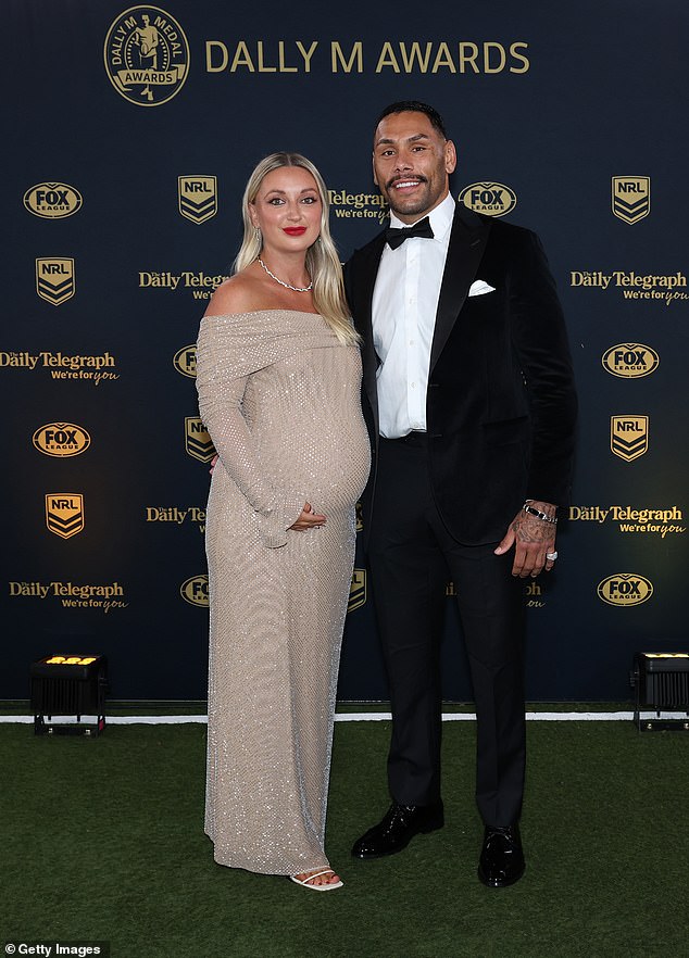 Cronulla Sharks center and his wife Shell (pictured, together) are desperate to arrange a flight home for their medically induced newborn.