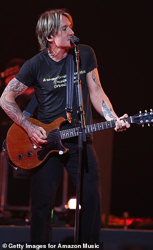 The Somebody Like You hitmaker looked casual for the concert, wearing a simple black T-shirt with what appeared to be a graphic pattern painted on the front.