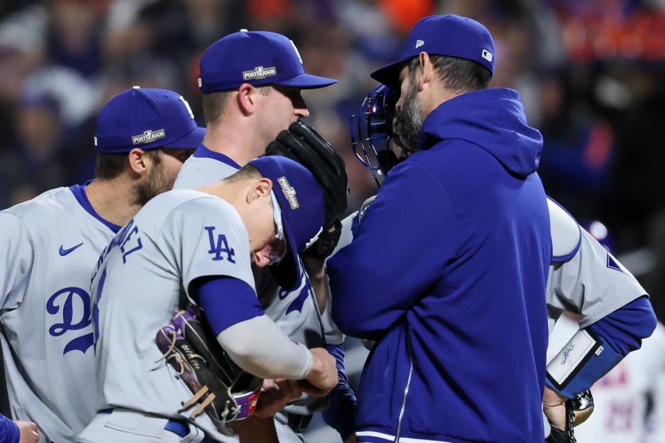 Dodgers reliever Evan Phillips talks with pitching coach Mark Prior during the sixth inning Thursday against the Mets.