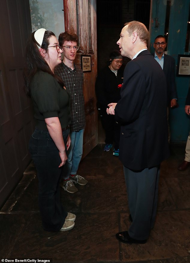 Edward seemed engaged as he chatted with other attendees before tonight's performance.