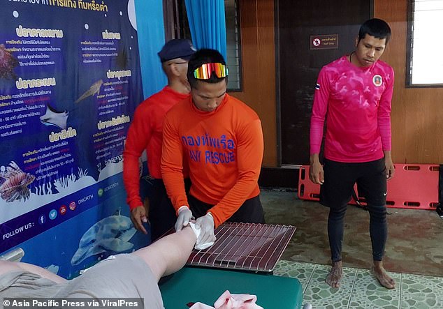 Members of the Thai Navy repaired the deep cut near his right Achilles tendon.