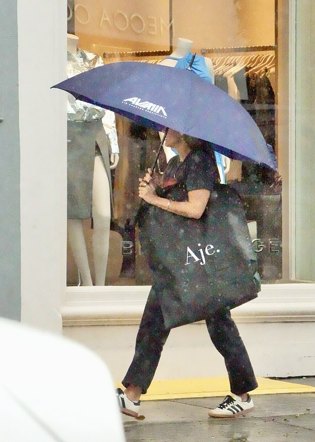 There was one essential accessory for a rainy day that Lauren couldn't be without in her house: a large black umbrella.