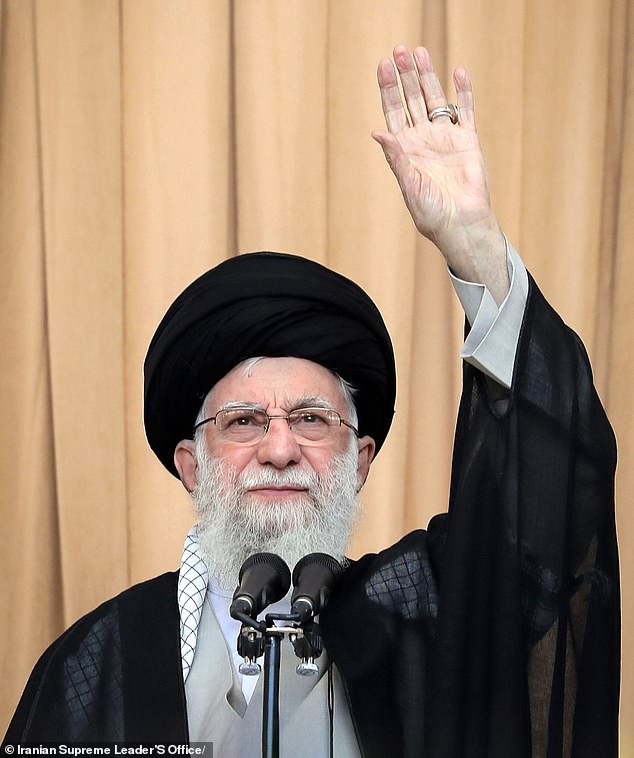 Iranian Supreme Leader Ayatollah Ali Khamenei waves before Friday prayer ceremony in Tehran.