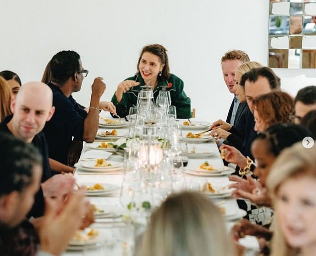 Jolie sits next to Chris as they chat with artist Prune, who was wearing a green cowgirl shirt.