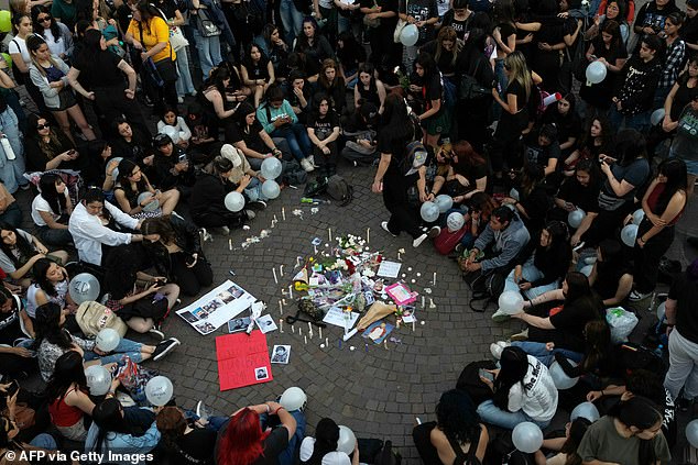 Fans light candles as they pay tribute to Liam Payne at the Obelisk in Buenos Aires last night