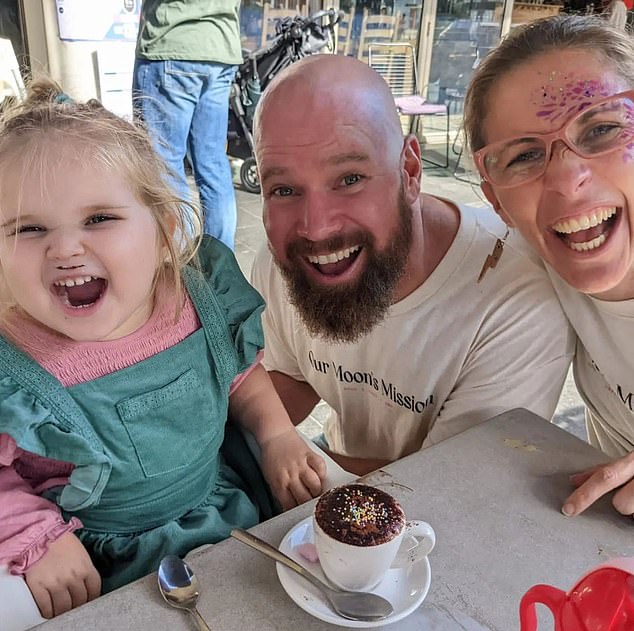 Tallulah is shown above with her parents. Her mother described her daughter looking at her parents as if asking why they couldn't help her.