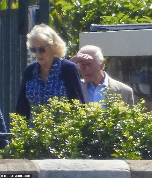 The Queen looked effortlessly elegant as she admired the gardens behind a pair of sunglasses, while Charles squinted in the bright morning sun.