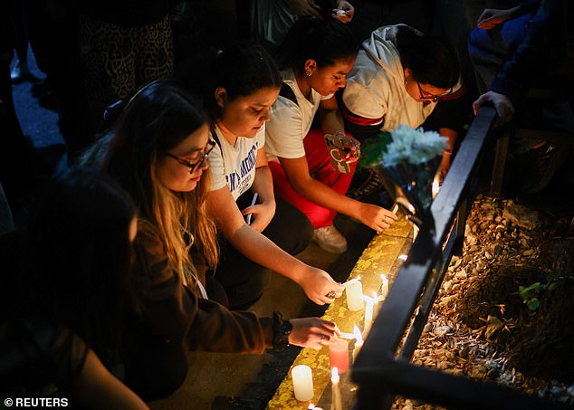 Fans place candles outside hotel where Liam Payne was found dead