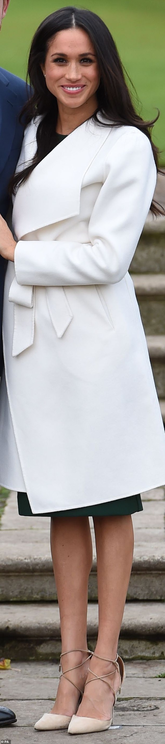 Meghan in a white belted coat by Line The Label and pale Aquazzura shoes in 2017