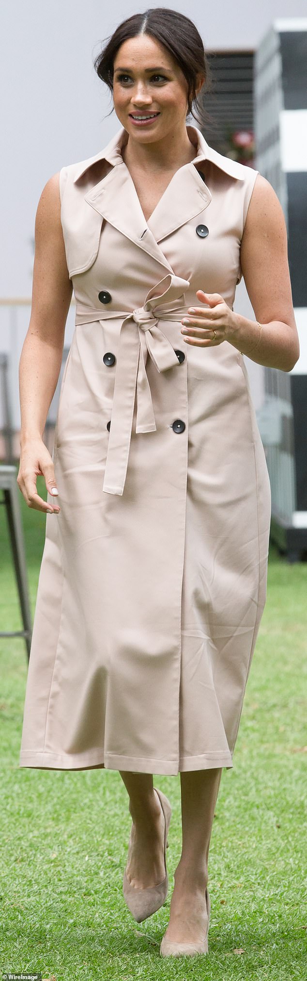 The Duchess wore this sleeveless trench-style dress for her interview with Tom Bradby in South Africa in October 2019.