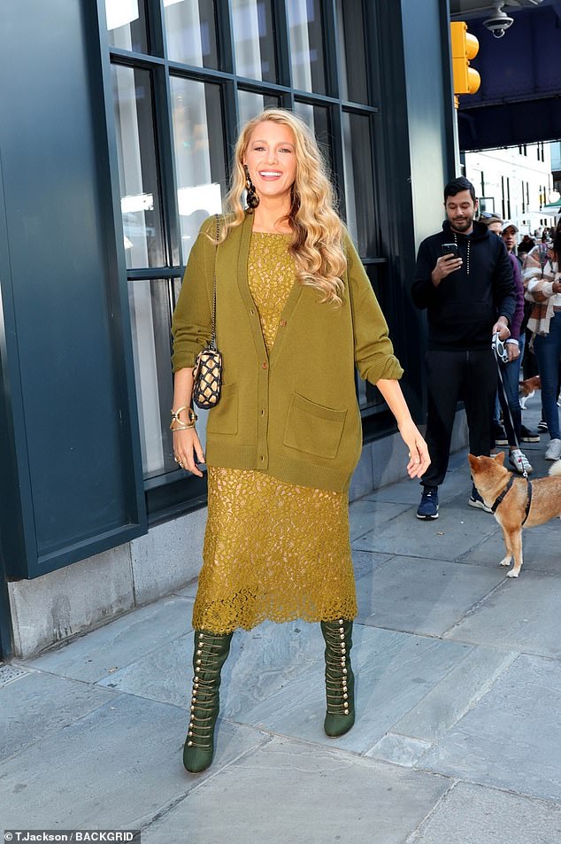 The actress styled her signature long, golden locks in waves and paired her elegant look with a black and gold designer bag.