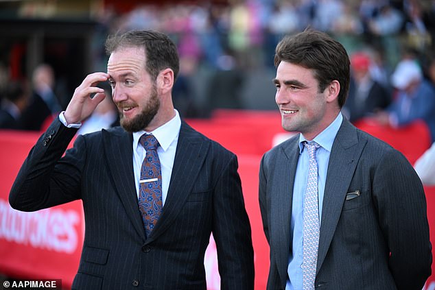 Trainers Ciaron Maher and David Eustace look on as jockey Craig Williams rides the mare to glory.