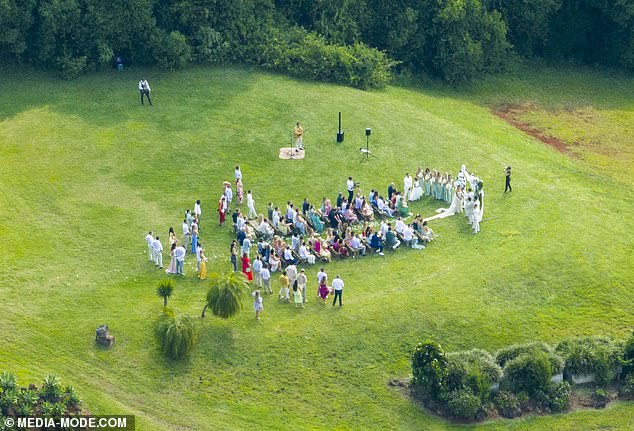 Luke and his groomsmen appeared to be wearing white suits, while Maria's bridesmaids looked stunning in silk dresses in pale teal shades.