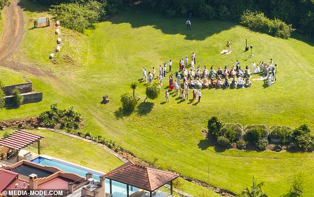 Several photographers captured the beautiful moment the couple exchanged vows as an artist sang and strummed his guitar as Maria walked down the grassy aisle.