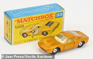 In the photo: an orange matchbox toy car.