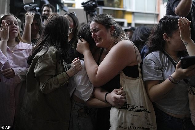 Liam Payne fans cry outside the Casa Sur Hotel where the British pop singer fell to his death on Wednesday.